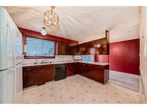 255 Rundleridge Drive Ne, Calgary, AB - Indoor Photo Showing Kitchen With Double Sink