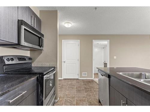 316-15 Saddlestone Way Ne, Calgary, AB - Indoor Photo Showing Kitchen