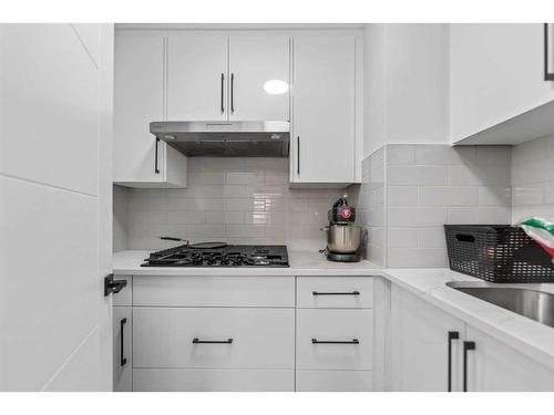 2046 Luxstone Boulevard, Airdrie, AB - Indoor Photo Showing Kitchen With Upgraded Kitchen