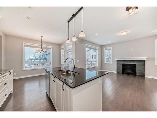 1204 Brightoncrest Green Se, Calgary, AB - Indoor Photo Showing Kitchen With Fireplace With Double Sink