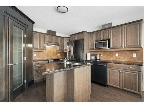 43 Prominence Path Sw, Calgary, AB - Indoor Photo Showing Kitchen With Double Sink