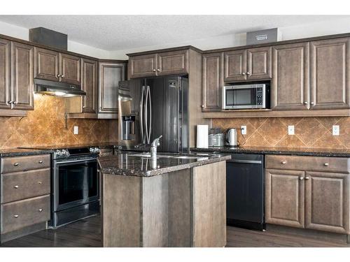 43 Prominence Path Sw, Calgary, AB - Indoor Photo Showing Kitchen With Double Sink With Upgraded Kitchen