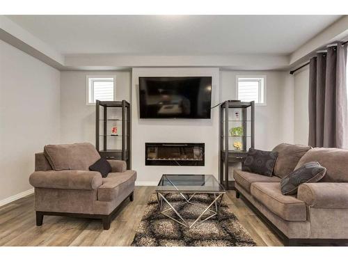 24 Osborne Link Sw, Airdrie, AB - Indoor Photo Showing Living Room With Fireplace