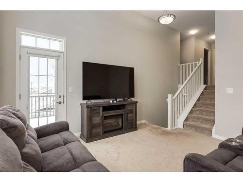 24 Osborne Link Sw, Airdrie, AB - Indoor Photo Showing Living Room