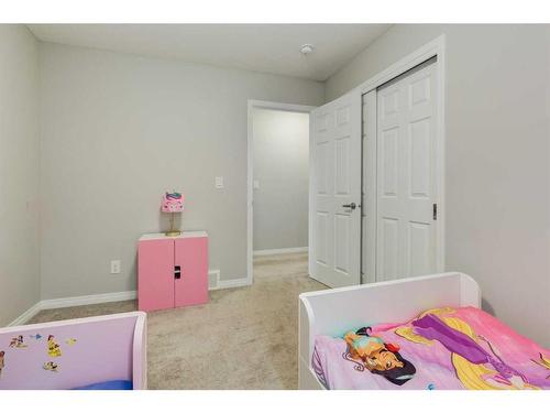 24 Osborne Link Sw, Airdrie, AB - Indoor Photo Showing Bedroom