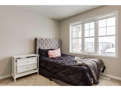 24 Osborne Link Sw, Airdrie, AB - Indoor Photo Showing Bedroom