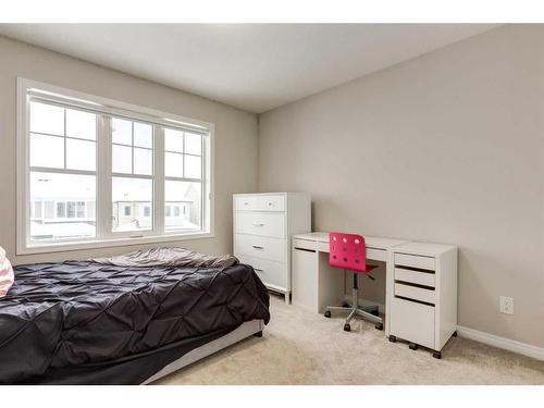 24 Osborne Link Sw, Airdrie, AB - Indoor Photo Showing Bedroom