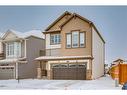 24 Osborne Link Sw, Airdrie, AB  - Outdoor With Balcony With Facade 