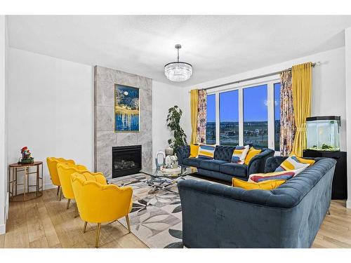 9 Sage Meadows Green Nw, Calgary, AB - Indoor Photo Showing Living Room With Fireplace