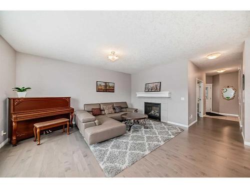 21 Sherwood Street Nw, Calgary, AB - Indoor Photo Showing Living Room With Fireplace