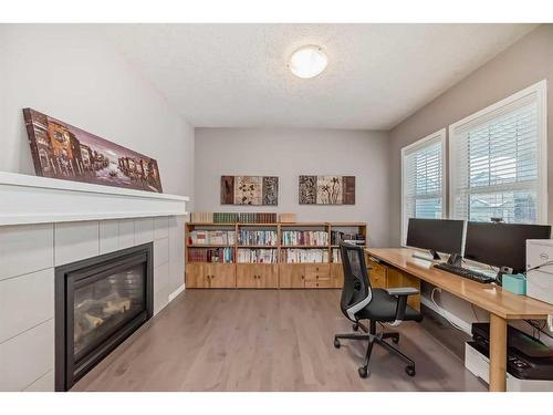 21 Sherwood Street Nw, Calgary, AB - Indoor With Fireplace