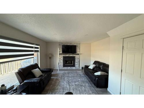 28 Macewan Ridge View Nw, Calgary, AB - Indoor Photo Showing Living Room With Fireplace