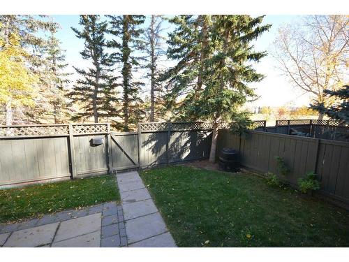 51-4936 Dalton Drive Nw, Calgary, AB - Outdoor With Backyard