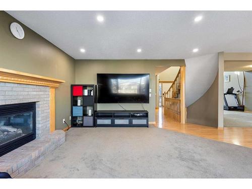 649 Hamptons Drive Nw, Calgary, AB - Indoor Photo Showing Living Room With Fireplace