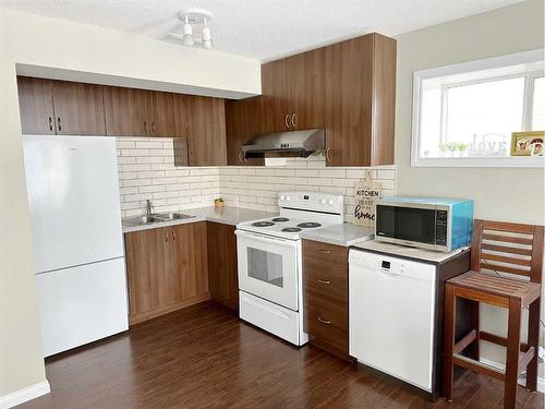 649 Hamptons Drive Nw, Calgary, AB - Indoor Photo Showing Kitchen With Double Sink