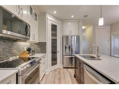 710 23 Avenue Nw, Calgary, AB - Indoor Photo Showing Kitchen With Stainless Steel Kitchen With Double Sink With Upgraded Kitchen