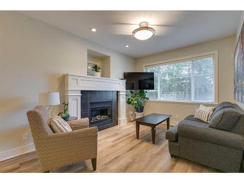 710 23 Avenue Nw, Calgary, AB - Indoor Photo Showing Living Room With Fireplace