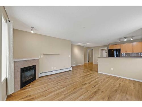 2107-70 Panamount Drive Nw, Calgary, AB - Indoor With Fireplace