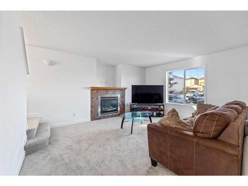 250 Covemeadow Crescent Ne, Calgary, AB - Indoor Photo Showing Living Room With Fireplace