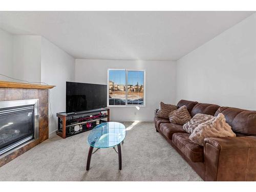 250 Covemeadow Crescent Ne, Calgary, AB - Indoor Photo Showing Living Room With Fireplace