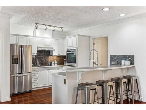 106-59 22 Avenue Sw, Calgary, AB - Indoor Photo Showing Kitchen With Upgraded Kitchen