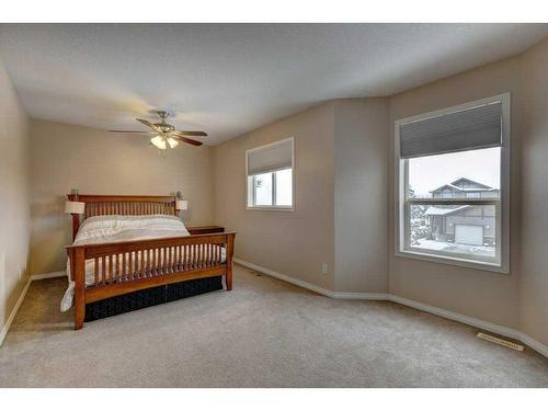 27 Spring Meadows Bay, Okotoks, AB - Indoor Photo Showing Bedroom