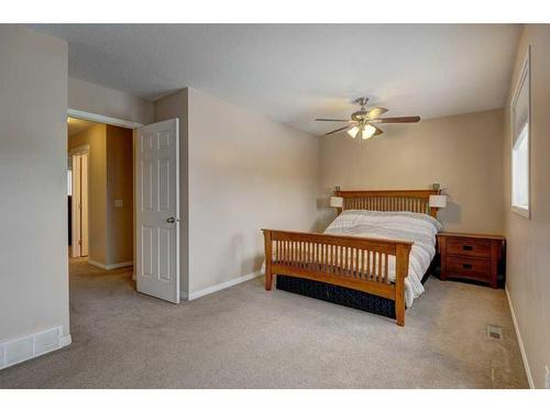 27 Spring Meadows Bay, Okotoks, AB - Indoor Photo Showing Bedroom