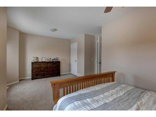 27 Spring Meadows Bay, Okotoks, AB - Indoor Photo Showing Bedroom