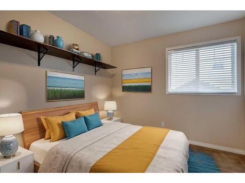 27 Spring Meadows Bay, Okotoks, AB - Indoor Photo Showing Bedroom