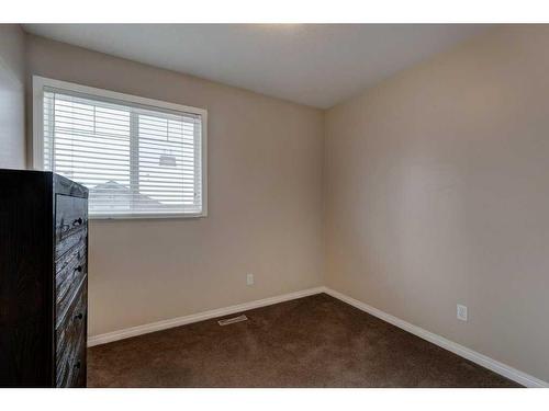 27 Spring Meadows Bay, Okotoks, AB - Indoor Photo Showing Other Room