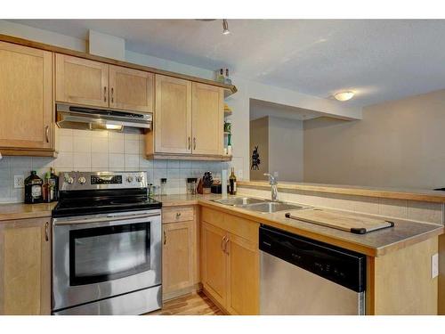 27 Spring Meadows Bay, Okotoks, AB - Indoor Photo Showing Kitchen With Double Sink