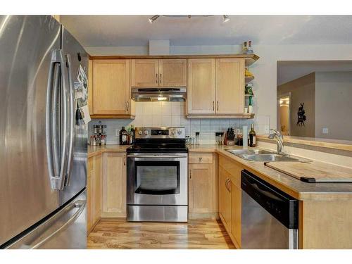 27 Spring Meadows Bay, Okotoks, AB - Indoor Photo Showing Kitchen With Double Sink