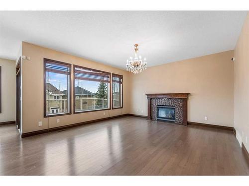 212 Cranarch Circle Se, Calgary, AB - Indoor Photo Showing Living Room With Fireplace