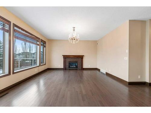 212 Cranarch Circle Se, Calgary, AB - Indoor Photo Showing Living Room With Fireplace