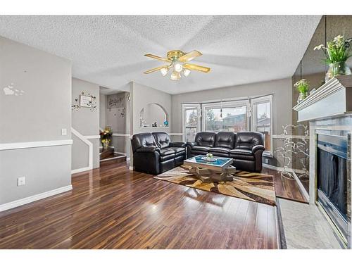 81 Castleglen Road Ne, Calgary, AB - Indoor Photo Showing Living Room With Fireplace