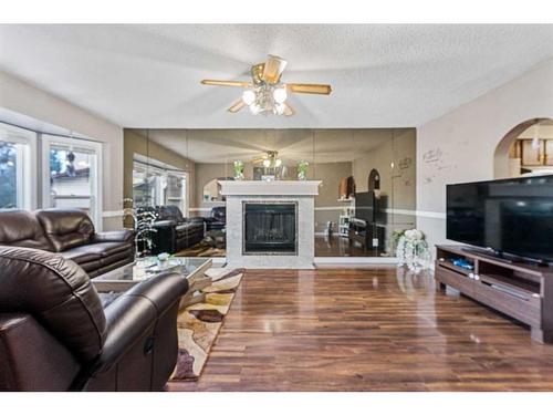 81 Castleglen Road Ne, Calgary, AB - Indoor Photo Showing Living Room With Fireplace