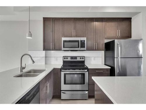 131 Redstone Circle Ne, Calgary, AB - Indoor Photo Showing Kitchen With Stainless Steel Kitchen With Double Sink With Upgraded Kitchen