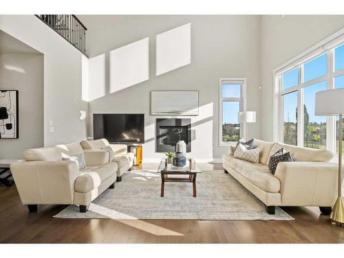 311 Silverado Crest Landing Sw, Calgary, AB - Indoor Photo Showing Living Room With Fireplace