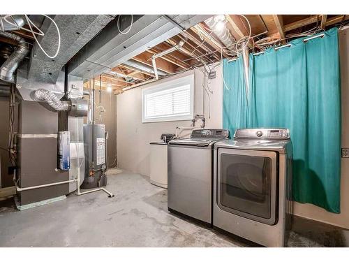 15 Alcock Close, Okotoks, AB - Indoor Photo Showing Laundry Room