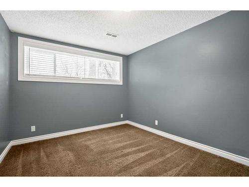 15 Alcock Close, Okotoks, AB - Indoor Photo Showing Other Room