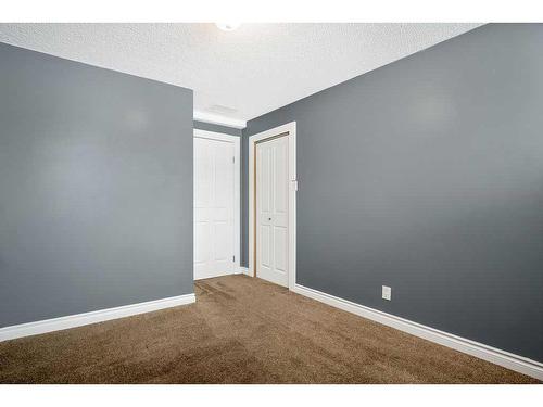 15 Alcock Close, Okotoks, AB - Indoor Photo Showing Other Room