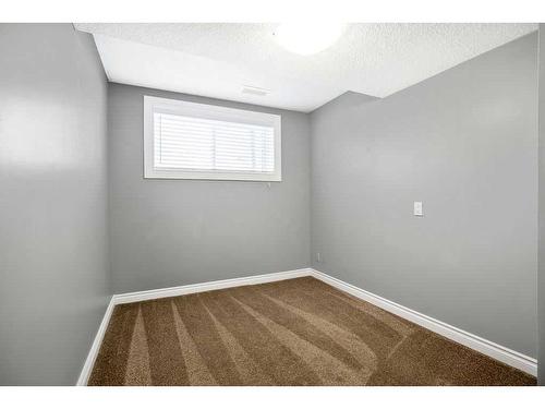 15 Alcock Close, Okotoks, AB - Indoor Photo Showing Other Room