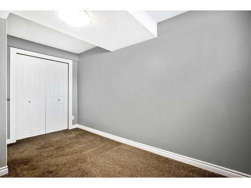 15 Alcock Close, Okotoks, AB - Indoor Photo Showing Other Room