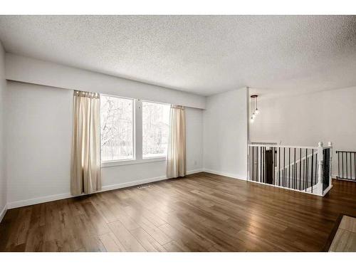 15 Alcock Close, Okotoks, AB - Indoor Photo Showing Other Room