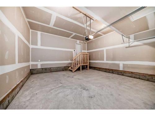 27 Saddlebred Place, Cochrane, AB - Indoor Photo Showing Garage