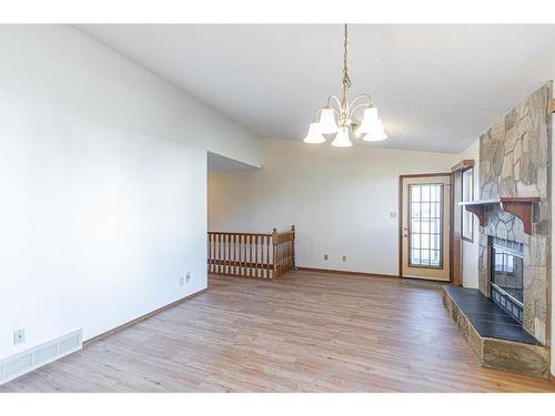 3908 14 Avenue Ne, Calgary, AB - Indoor Photo Showing Other Room With Fireplace