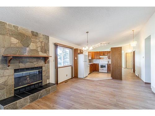 3908 14 Avenue Ne, Calgary, AB - Indoor Photo Showing Living Room With Fireplace