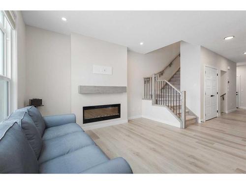 254 Alpine Boulevard Sw, Calgary, AB - Indoor Photo Showing Living Room With Fireplace