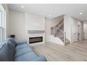 254 Alpine Boulevard Sw, Calgary, AB  - Indoor Photo Showing Living Room With Fireplace 