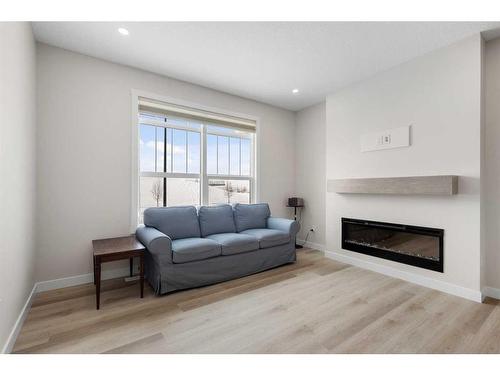 254 Alpine Boulevard Sw, Calgary, AB - Indoor Photo Showing Living Room With Fireplace